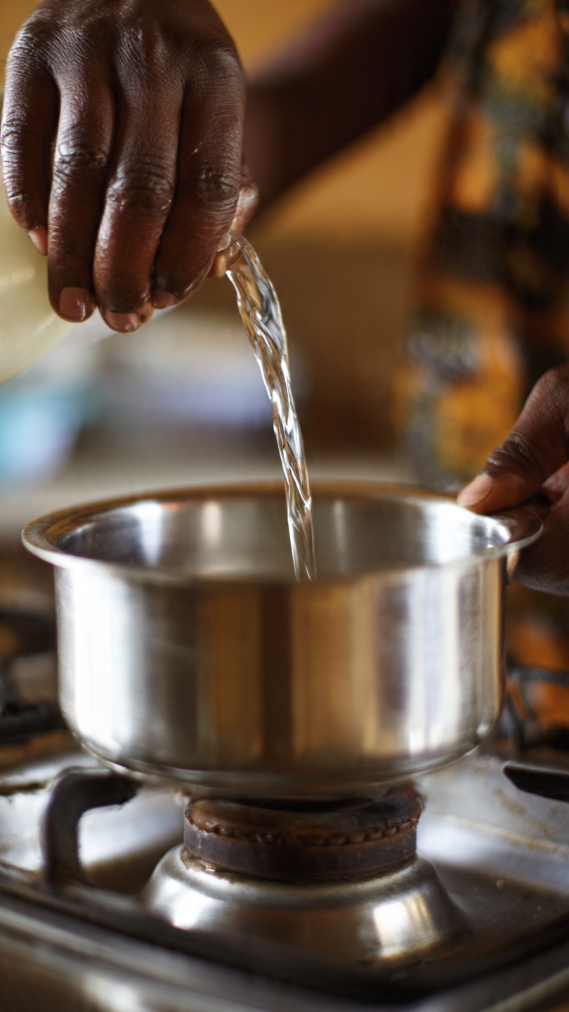 Pouring milk into saucepan